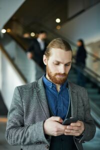 Businessman using mobile app on gadget